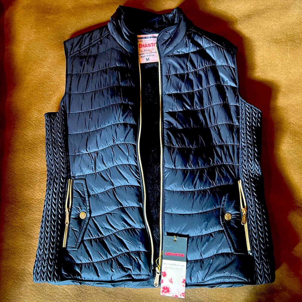Warm winter vest, black with gold accents, soft plush inside lining.